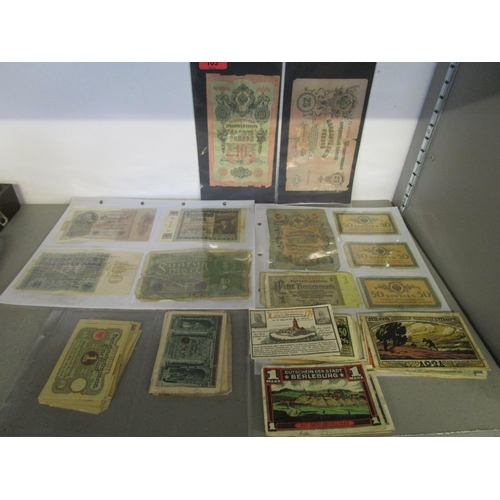 103 - A quantity of Russian and German emergency currency from the 1920s to include those with designs, al... 