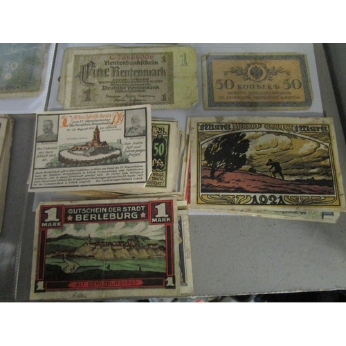 103 - A quantity of Russian and German emergency currency from the 1920s to include those with designs, al... 