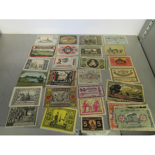 103 - A quantity of Russian and German emergency currency from the 1920s to include those with designs, al... 