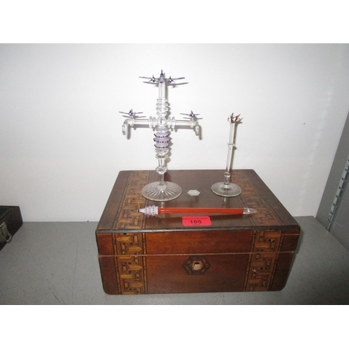 105 - A 19th century German strap-work box containing a lampwork glass double watch stand with RAF aeropla... 