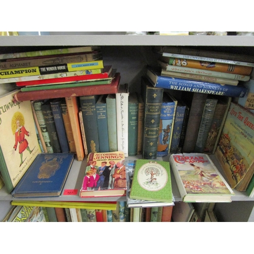 107 - Two shelves of mixed children's books to include Black Beauty, Jennings, Tarzan, Biggles, Swallows a... 