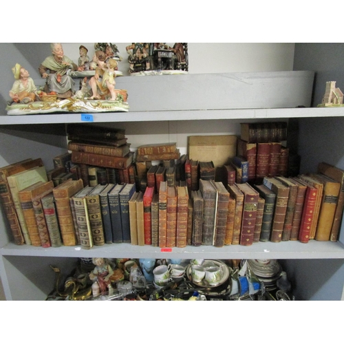 111 - A selection of antiquarian leather bound books and others to include three volumes of Movement du Mo... 