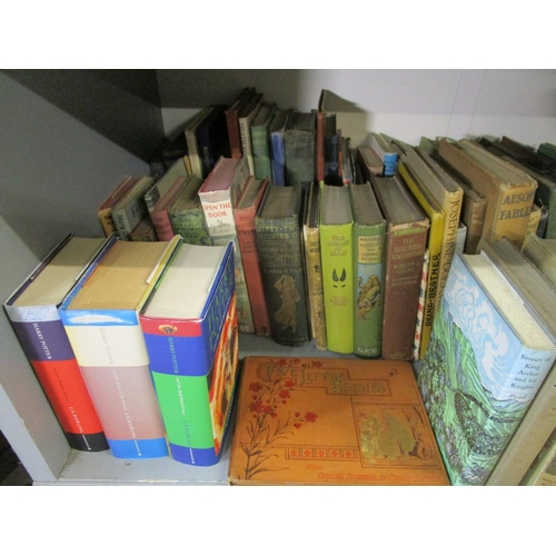 112 - A quantity of mainly children's books, annuals and comics to include three Harry Potter 1st editions... 