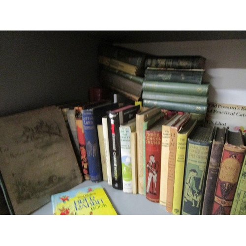 113 - A shelf of mainly children's books and annuals to include T S Eliot's Old Possum's Book of Practical... 