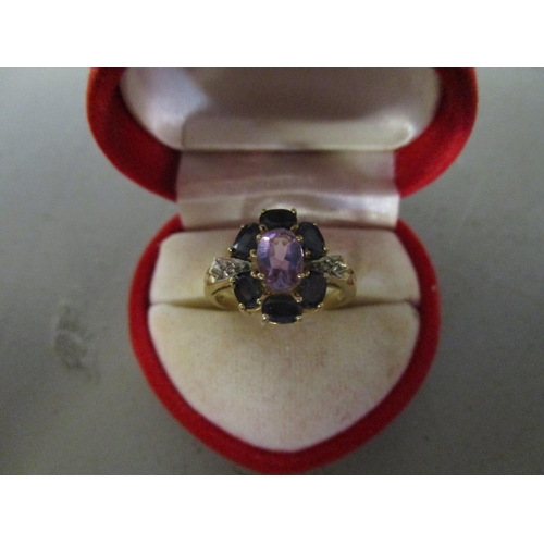 124 - A 10ct gold sapphire, diamond and amethyst set cluster ring
Location: CAB