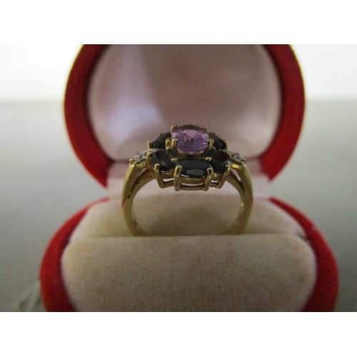 124 - A 10ct gold sapphire, diamond and amethyst set cluster ring
Location: CAB