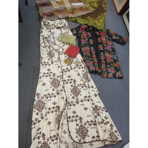 175 - A quantity of 1960s and 1970s clothing to include an Eastern black tunic with needlepoint embroidery... 