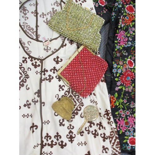 175 - A quantity of 1960s and 1970s clothing to include an Eastern black tunic with needlepoint embroidery... 