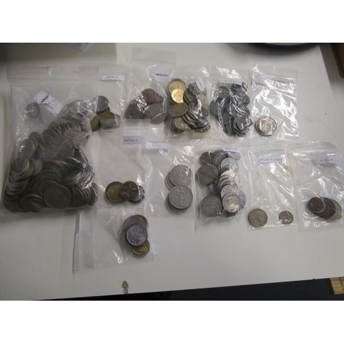 266 - A large lot (approximately 8 kg) of foreign coins from over 60 countries including more unusual coun... 