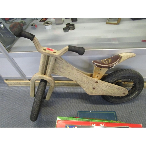 268 - Circa 1960 a wooden framed child's Early Rider bike, and a quantity of board games. 
Position: STAIR... 