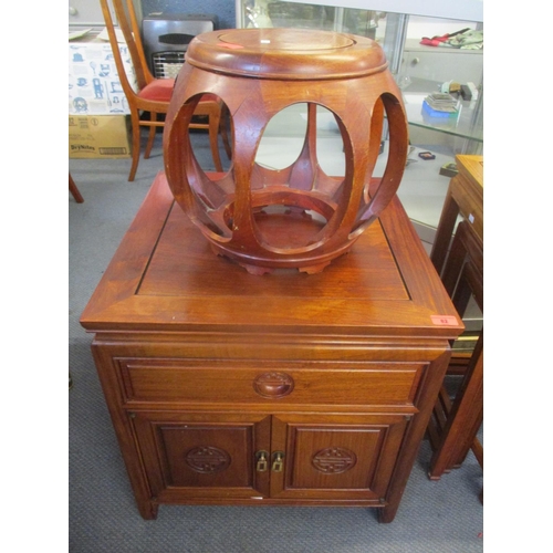 82 - A modern Oriental rosewood cabinet, together with a vase stand
Location: BWR