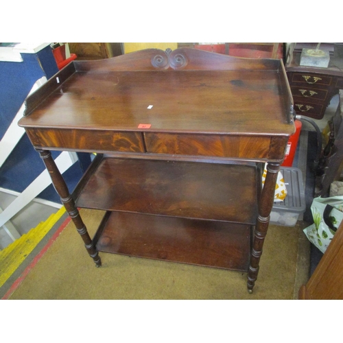 87 - A Victorian mahogany three tier buffet stand having two inset drawers and turned legs 38 1/2