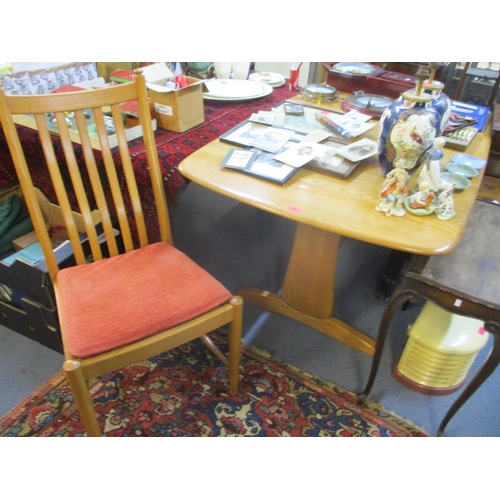 74 - An Ercol blonde elm extending dining table, 29