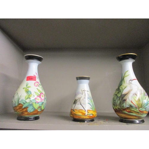 141 - Three Victorian painted ceramic vases with black base and rims, the body of the vases painted with s... 