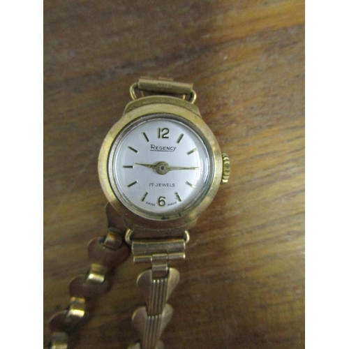 294 - A Regency gold cased ladies wristwatch on a 9ct gold bracelet
Location: CAB