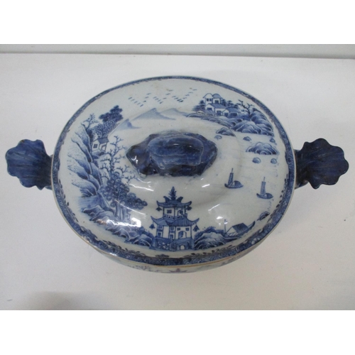 21 - A late 18th century Chinese tureen and cover with a domed lid and wave finial, a bellied, tapered bo... 