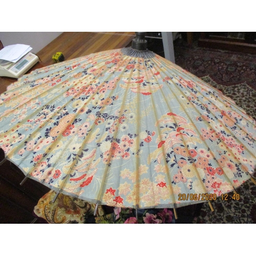 198 - An early 20th century crushed velvet table throw in burgundy with tassels, an early 20th century Ori... 
