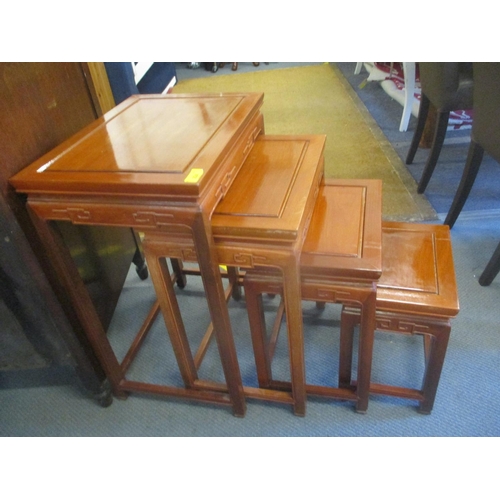 224 - A nest of four Chinese rosewood tables, the largest 26