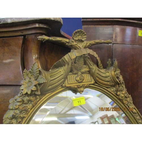 80 - A late 19th century French gilt Girondole wall mirror with candle sconces having a horn and floral d... 