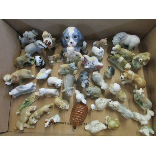 86 - A collection of Wade 1st Whimsies and Disney porcelain model animals to include a swan
Location: 9:5