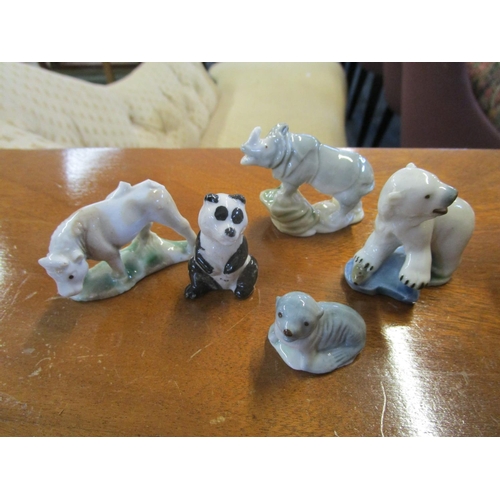 86 - A collection of Wade 1st Whimsies and Disney porcelain model animals to include a swan
Location: 9:5