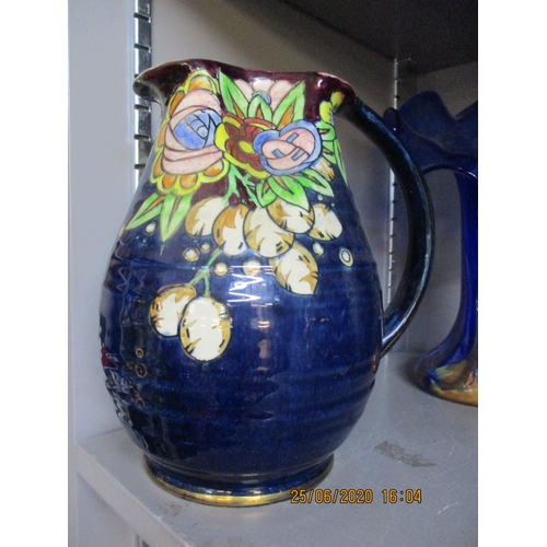 5 - A Bursley ware Charlotte Rhead jug, a Royal Winton jug, a John Peel musical jug and other items to i... 