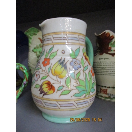 5 - A Bursley ware Charlotte Rhead jug, a Royal Winton jug, a John Peel musical jug and other items to i... 