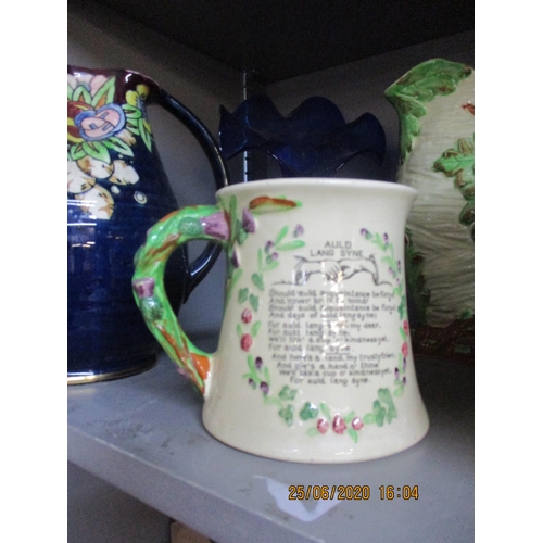 5 - A Bursley ware Charlotte Rhead jug, a Royal Winton jug, a John Peel musical jug and other items to i... 