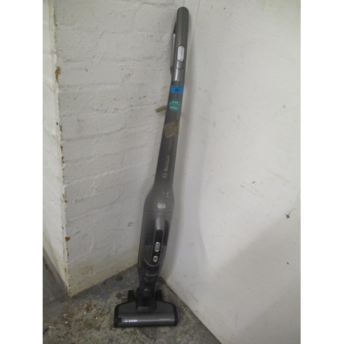 66 - A Bosch cordless vacuum cleaner and cables.
Location: RWM