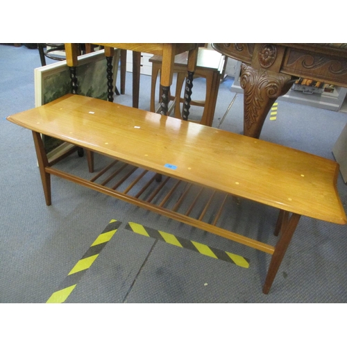 69 - A mid 20th century teak two tier long John coffee table, 15 3/4