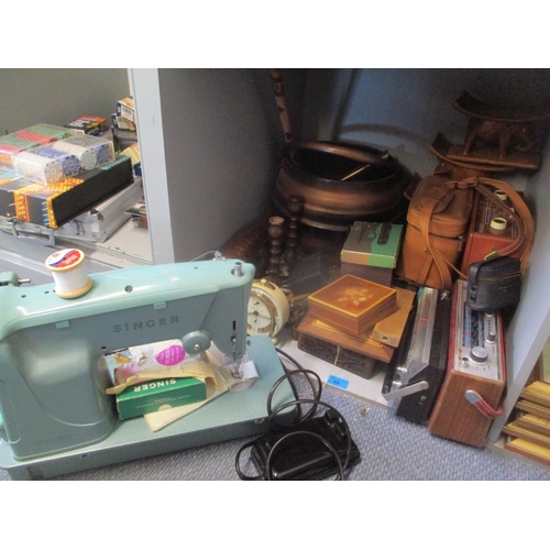 98 - A mixed lot to include a Singer sewing machine, radio players, binoculars, African head rests, mixed... 