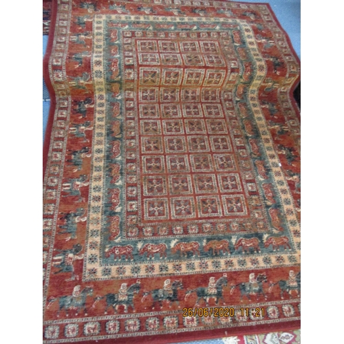 99 - A modern red ground rug having multiguard borders, one border having a frieze of horses, 53