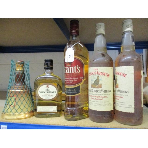 425 - Five mixed bottles of Scotch Whisky to include The Famous Grouse 75cl, Grants 1lt, Bells and High Co... 