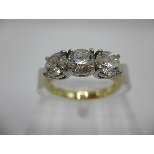 221 - An 18ct gold three stone diamond ring approximately 1.50ct, total size L/M, 4.2g