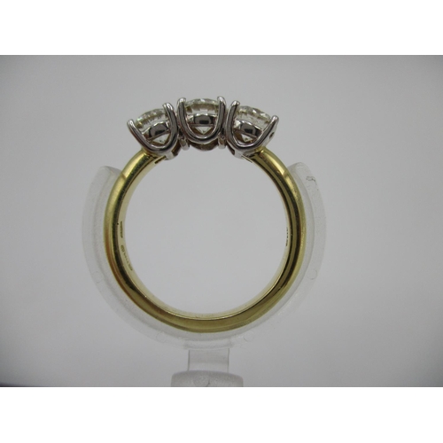 221 - An 18ct gold three stone diamond ring approximately 1.50ct, total size L/M, 4.2g