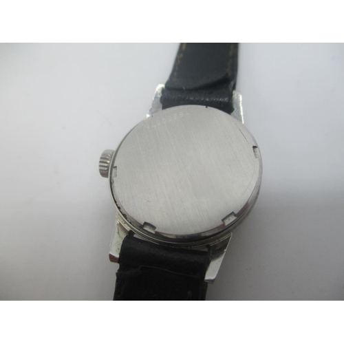 35 - A Girard Perregaux manual wind stainless steel ladies wristwatch, having a silvered dial with baton ... 