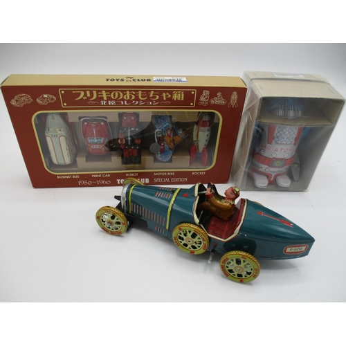 103 - A Japanese boxed wind up Action Mr Atomic tin toy robot by Cragstan, limited edition, 4