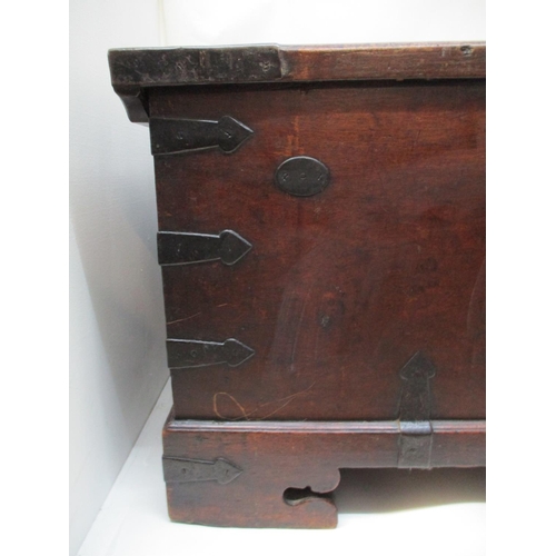 230 - An 18th century continental walnut chest with iron corners, strapwork and handles, having a hinged t... 