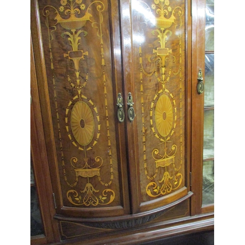 231 - An Edwardian Taylor and Hobson mahogany and extensive marquetry inlaid display cabinet with a centra... 