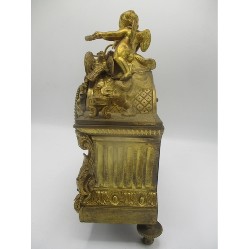 47 - A mid/late 19th century French gilt metal mantle clock decorated with a cherub to the top with two b... 