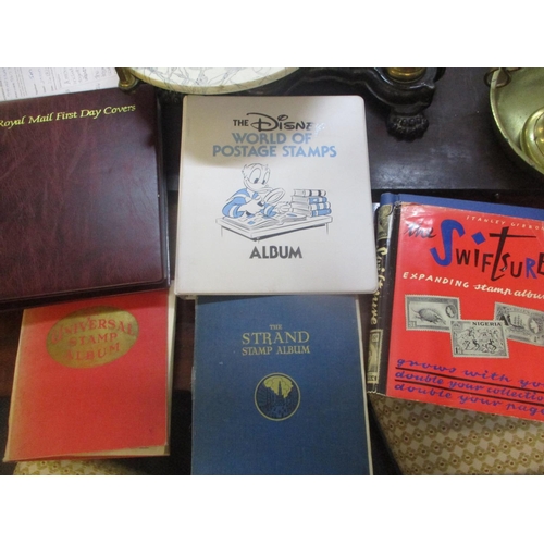 The Disney World of postage stamps, together with an album of first day  covers and three albums of s