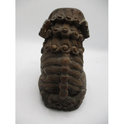 36 - A 20th century Chinese carved wooden foo dogs with a ball, 7