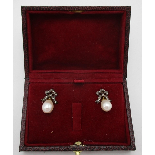 259 - A pair of silver earrings with diamond set bow tops and pearl pendants, boxed
 reeded edgeCAB