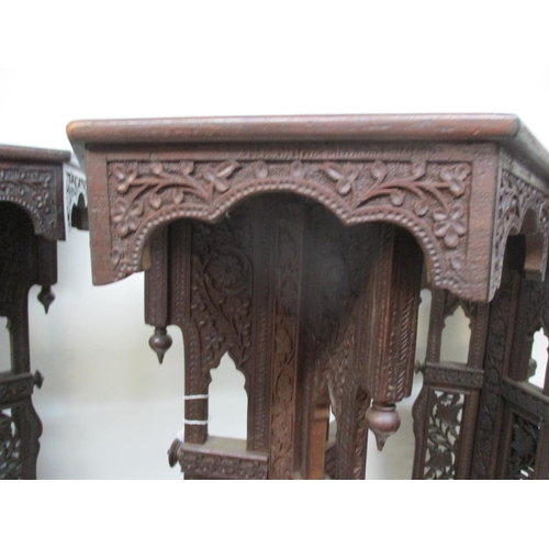 41 - A set of three early 20th century Anglo Indian, carved hardwood plant stands, with hexagonal tops, o... 