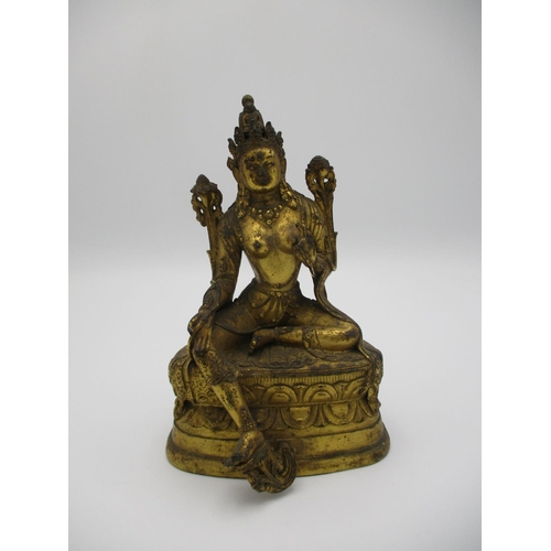 98 - A Sino Tibetan gilt bronze statue of Tara Bodhisattva seated in lalitasana, on an oval double lotus ... 