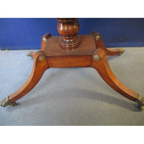 258 - A Regency brass inlaid rosewood sofa table with twin fall flaps and a reeded edge, over a pair of dr... 