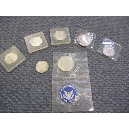 79 - A group of American coins to include 1964 Kennedy half dollars and a 1971 uncirculated D Eisenhower ... 
