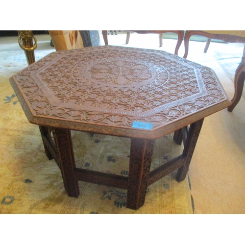 26 - A carved teak hardwood occasional table, 12 3/4
