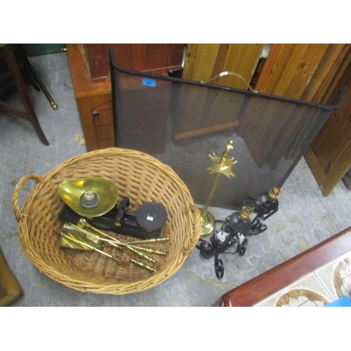 90 - A mixed lot to include a wicker basket, fireside implements, weighing scales, two table lamps, a fir... 