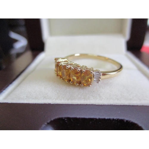 16 - An 18ct yellow gold and yellow sapphire and diamond ring
Location: CAB
